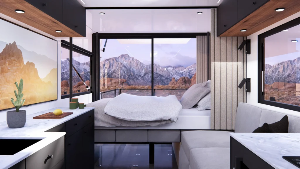 사이버트레일러 내부 침실 모드에서 침대가 뒤쪽으로 펼쳐지고, 통유리 창 너머 산과 사막 풍경이 보이는 인테리어 렌더링