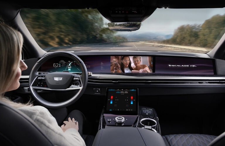 Super Cruise vs Tesla FSD Luxurious interior of 2026 GMC Acadia with 15-inch screen