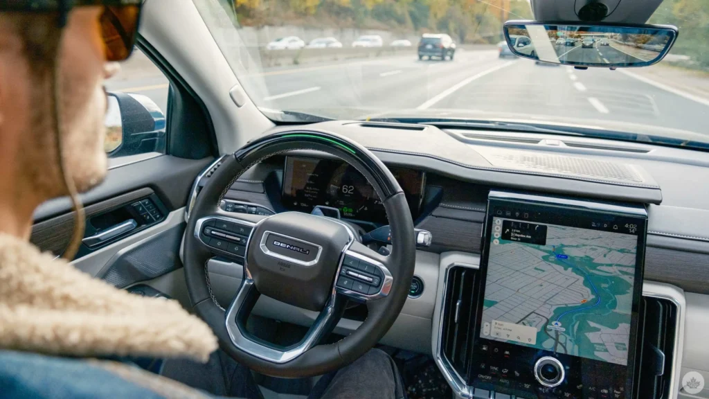 Driver using Super Cruise hands-free in GMC Acadia